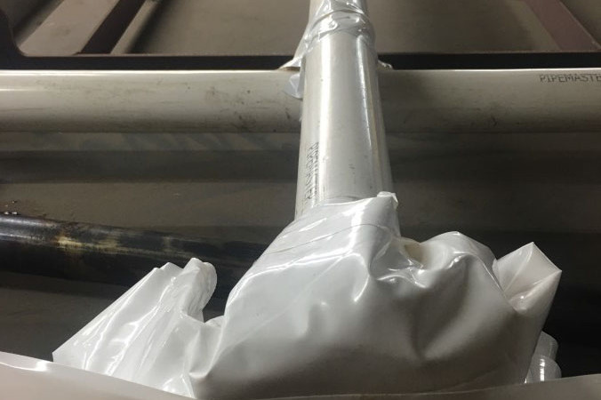 applying anti corrosion film on a flat surface